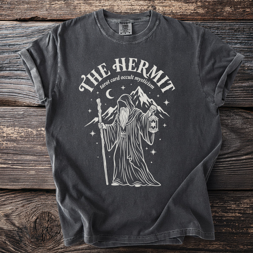 Dark gray t-shirt with a white graphic of a robed figure holding a staff and lantern.