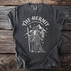 Dark gray t-shirt with a white graphic of a robed figure holding a staff and lantern.