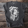 Dark gray t-shirt with a white graphic of a skeleton in a Santa hat holding a lantern.