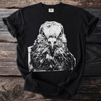 Black t-shirt with a close-up white ink sketch of a bird's head from the front.