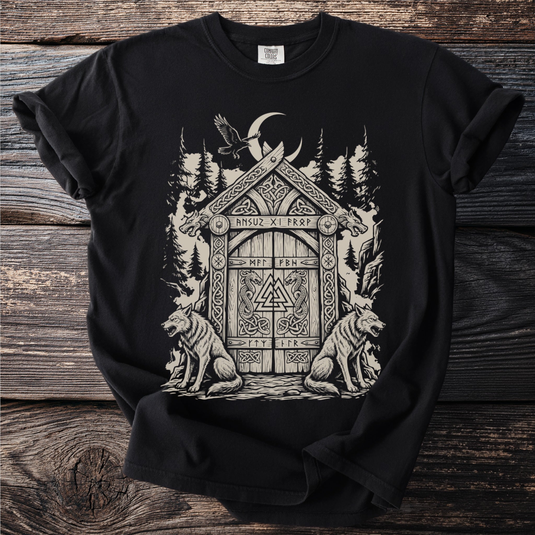 Black t-shirt with screen print of Norse-inspired art featuring wolves and a wooden door.