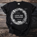 Black t-shirt with white "Love the Unloved" text and insect illustrations in a circle.