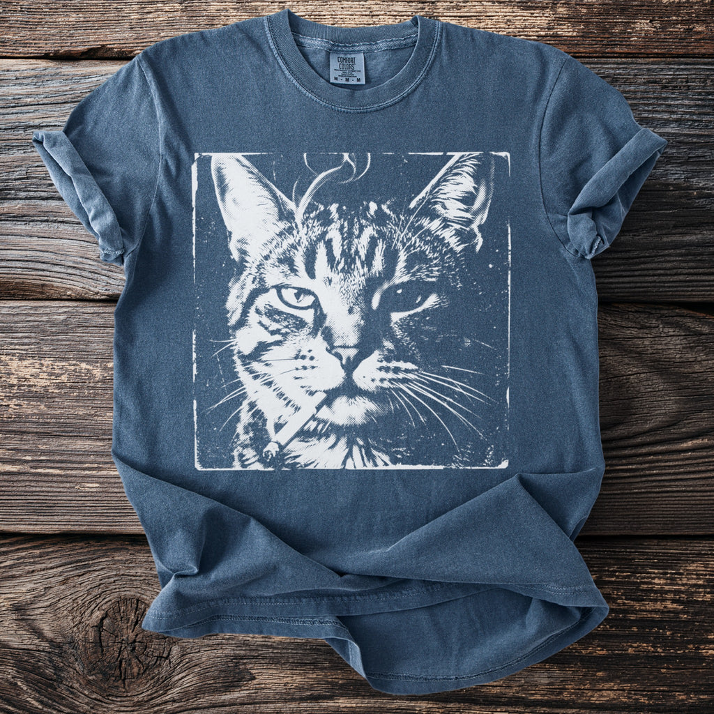 Blue t-shirt with a distressed print of a cat holding a cigarette.