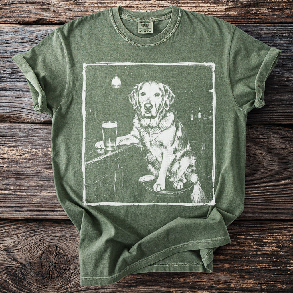 Green t-shirt with graphic of a golden retriever at a bar with a beer.