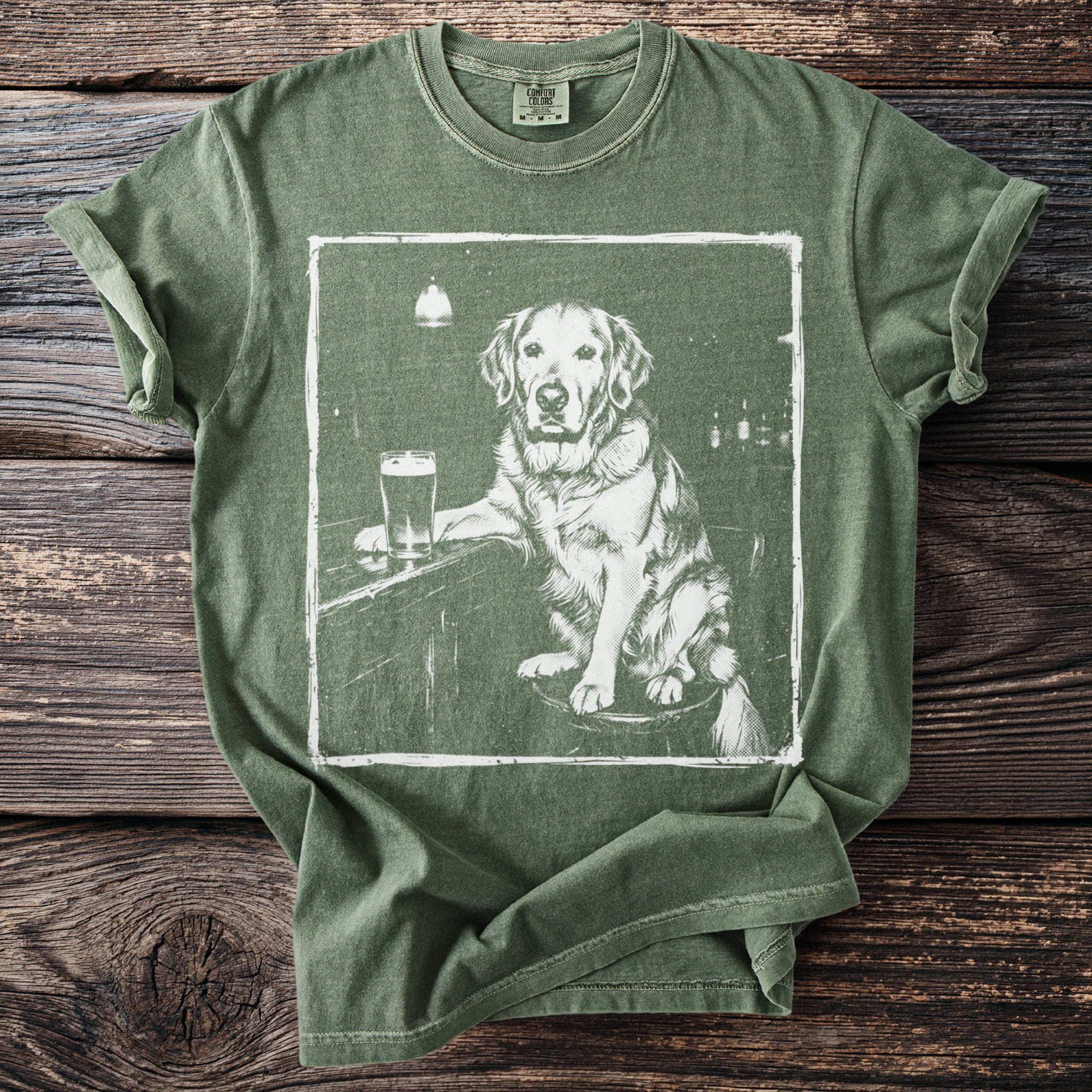 Green t-shirt with graphic of a golden retriever at a bar with a beer.