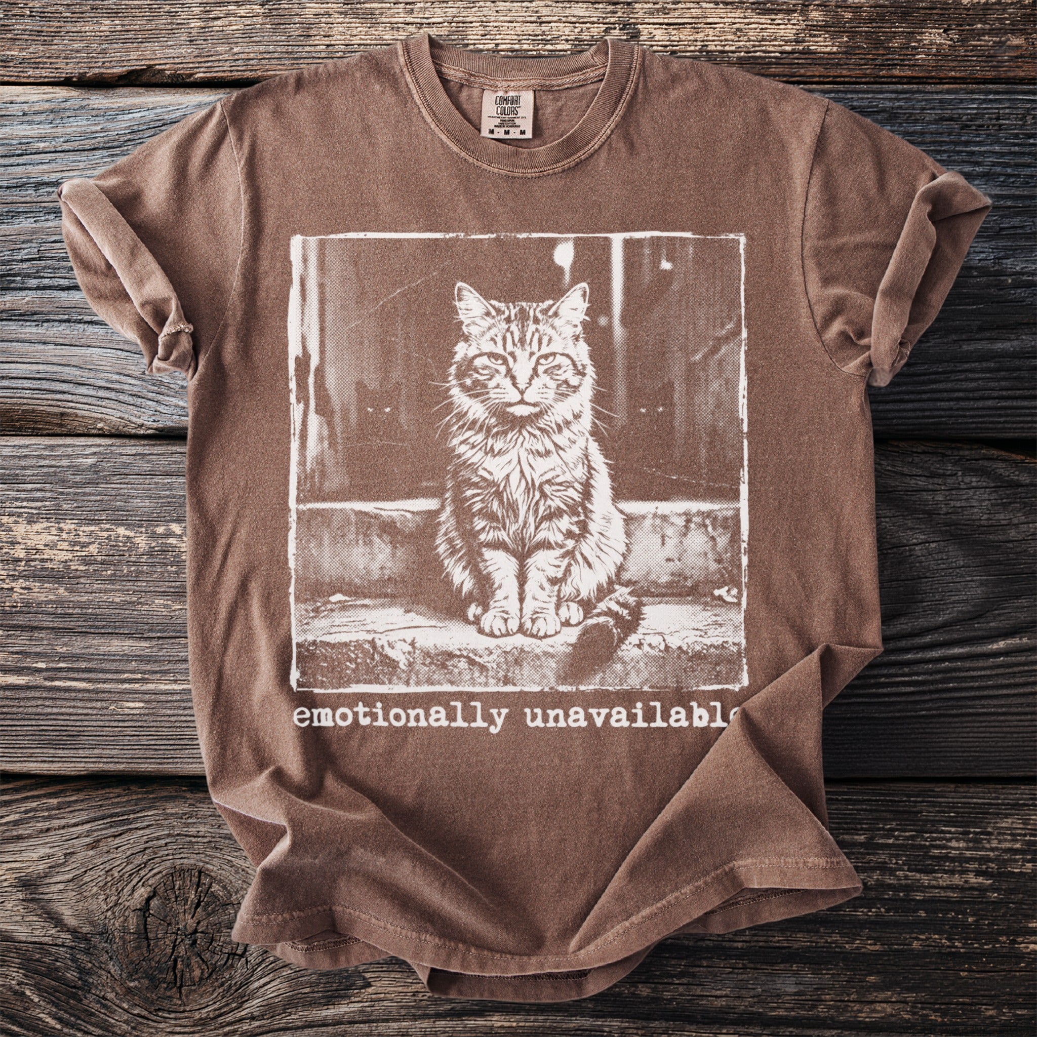 Brown t-shirt with vintage cat graphic and "emotionally unavailable" text.