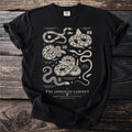 Black t-shirt with detailed scientific illustrations of snakes including Gaboon Viper and Ball Python.