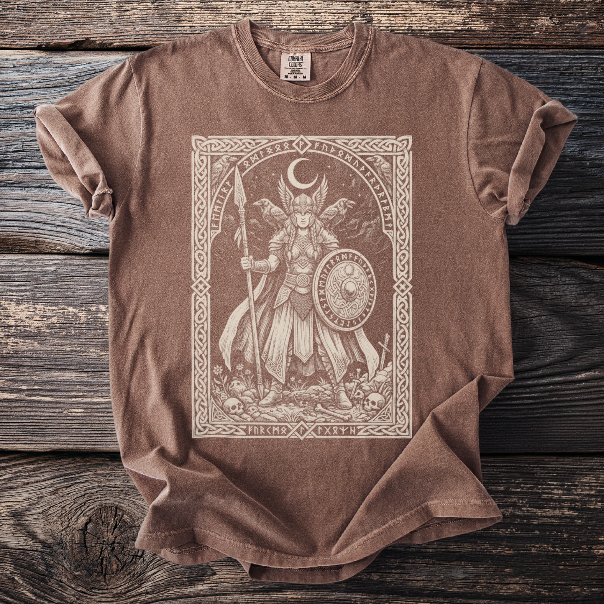 T-shirt with a framed depiction of a Valkyrie holding a spear and shield.