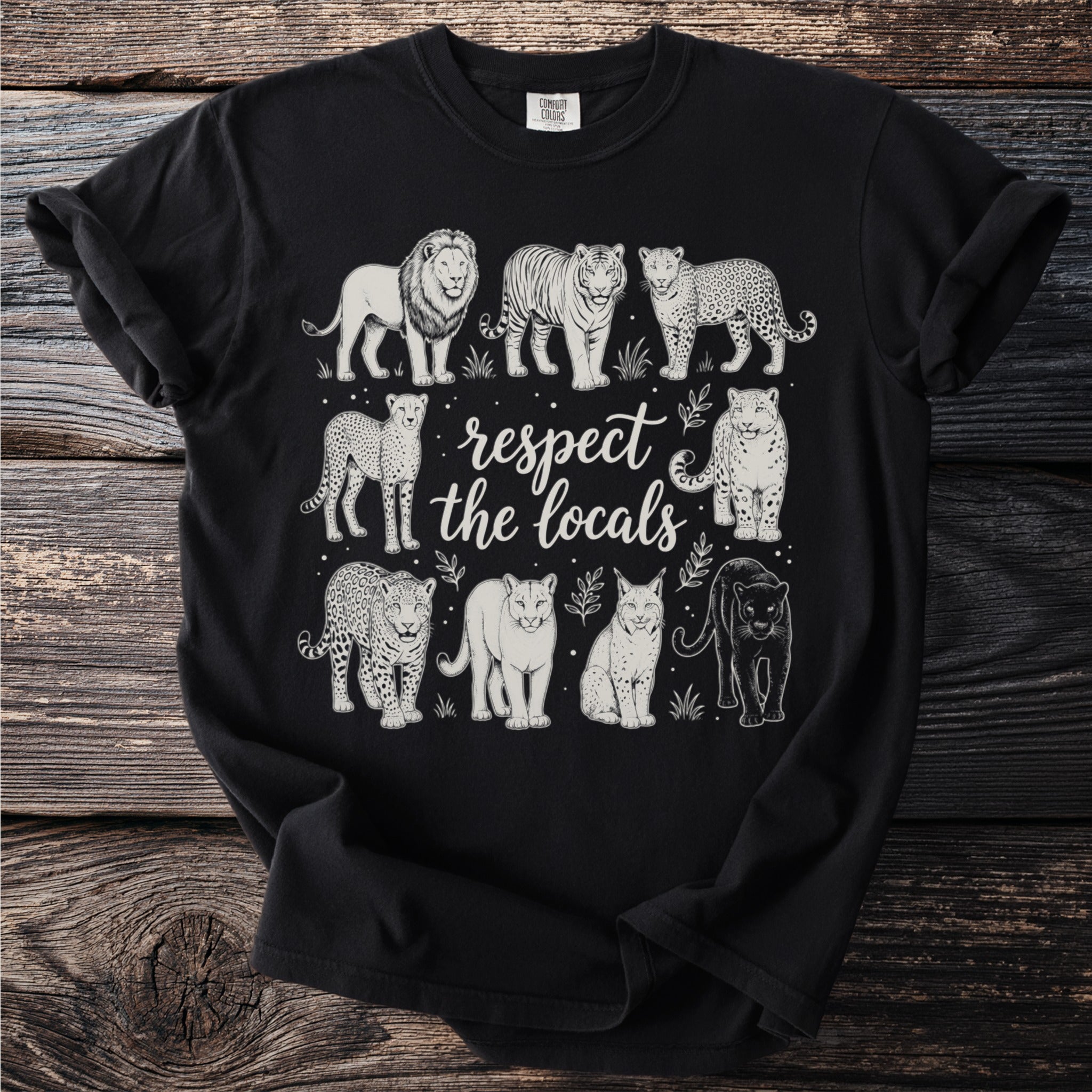 Black t-shirt with a design of wild cats and the text "respect the locals."