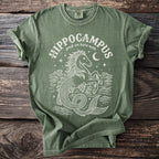 Green t-shirt with white "Hippocampus greek sea horse myth" text and graphic.