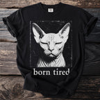 Black t-shirt with a close-up, distressed graphic of a Sphynx cat and the text "born tired".