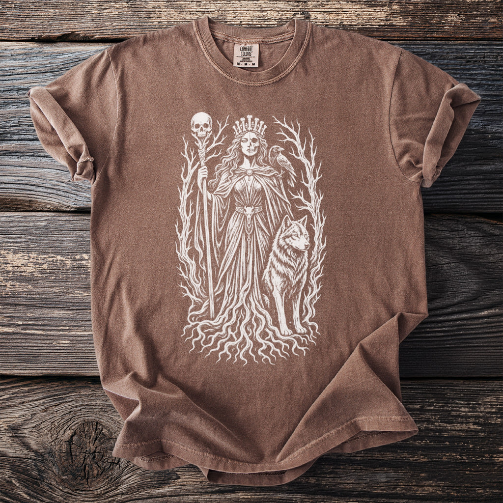 Brown t-shirt with a white graphic of a crowned skeletal figure holding a staff and a wolf.