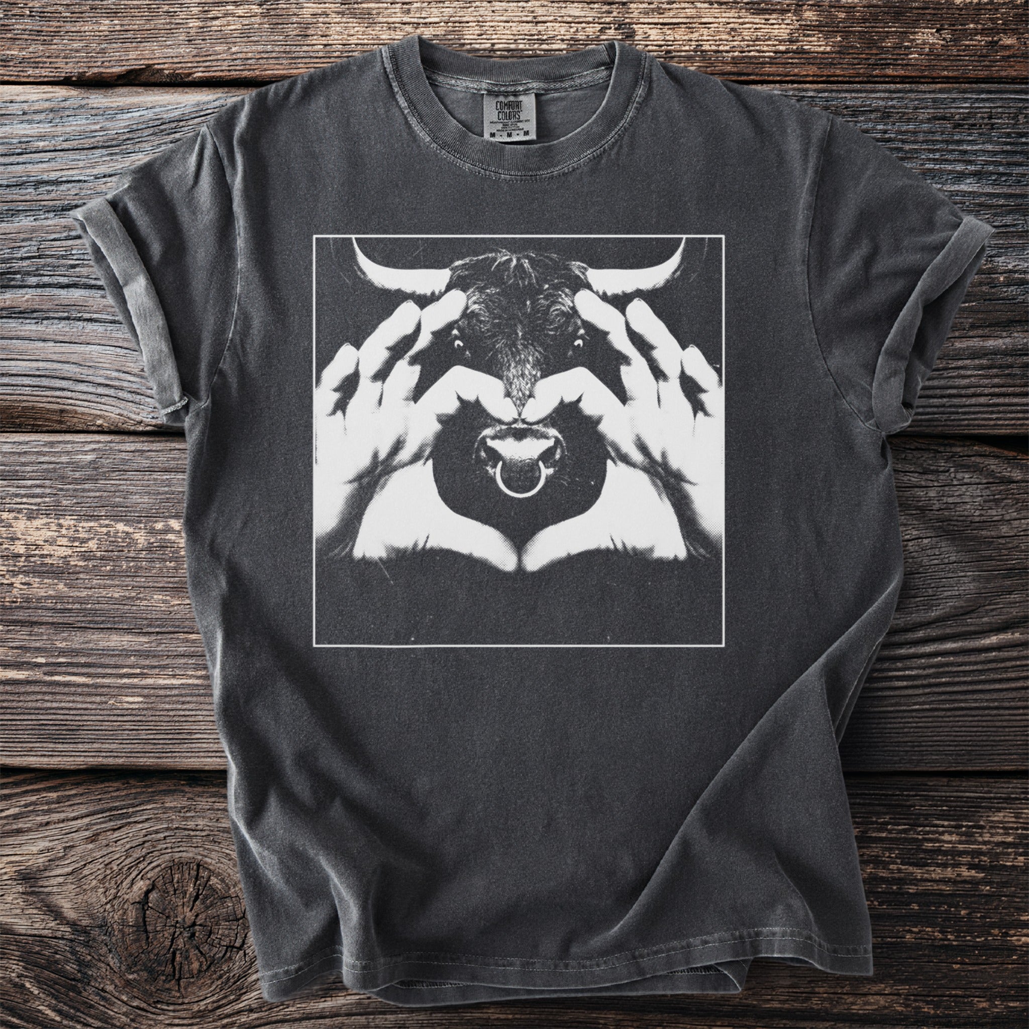 Charcoal t-shirt with a white outline square containing a bull's head and hands forming a heart.