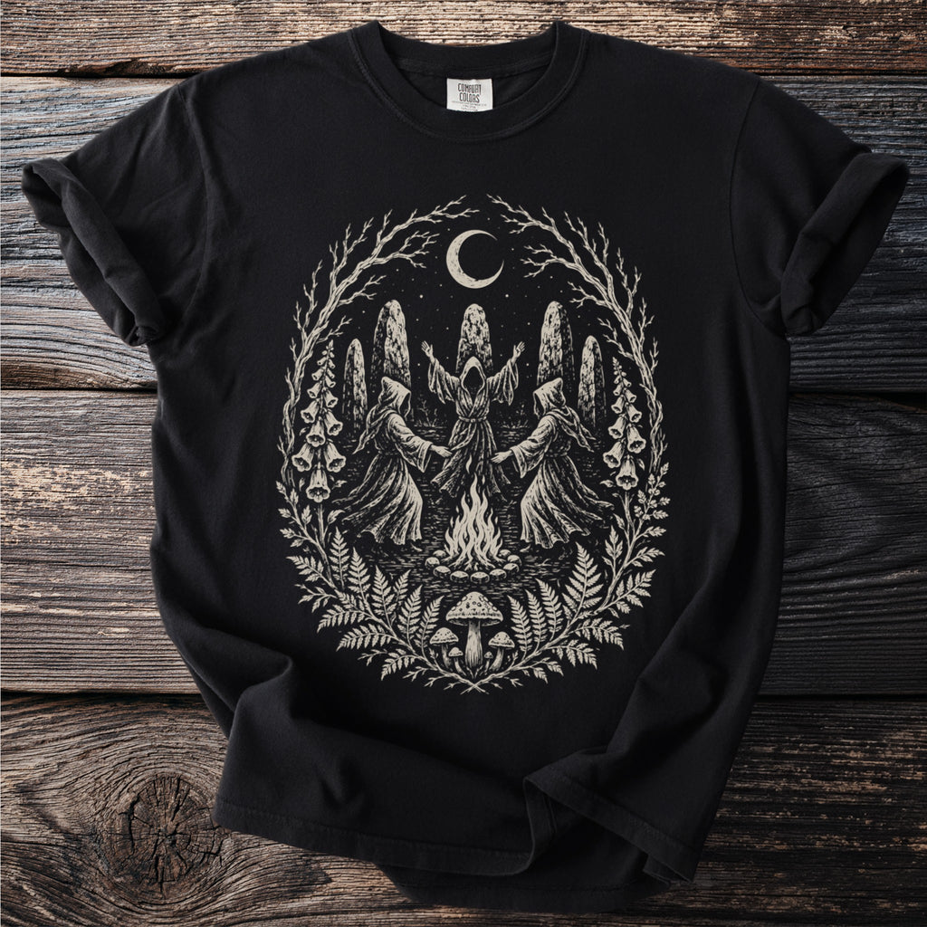 Black t-shirt with occult design of hooded figures around a campfire under a moon.