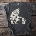 Werewolf gently touching a white cat on a charcoal grey t-shirt.