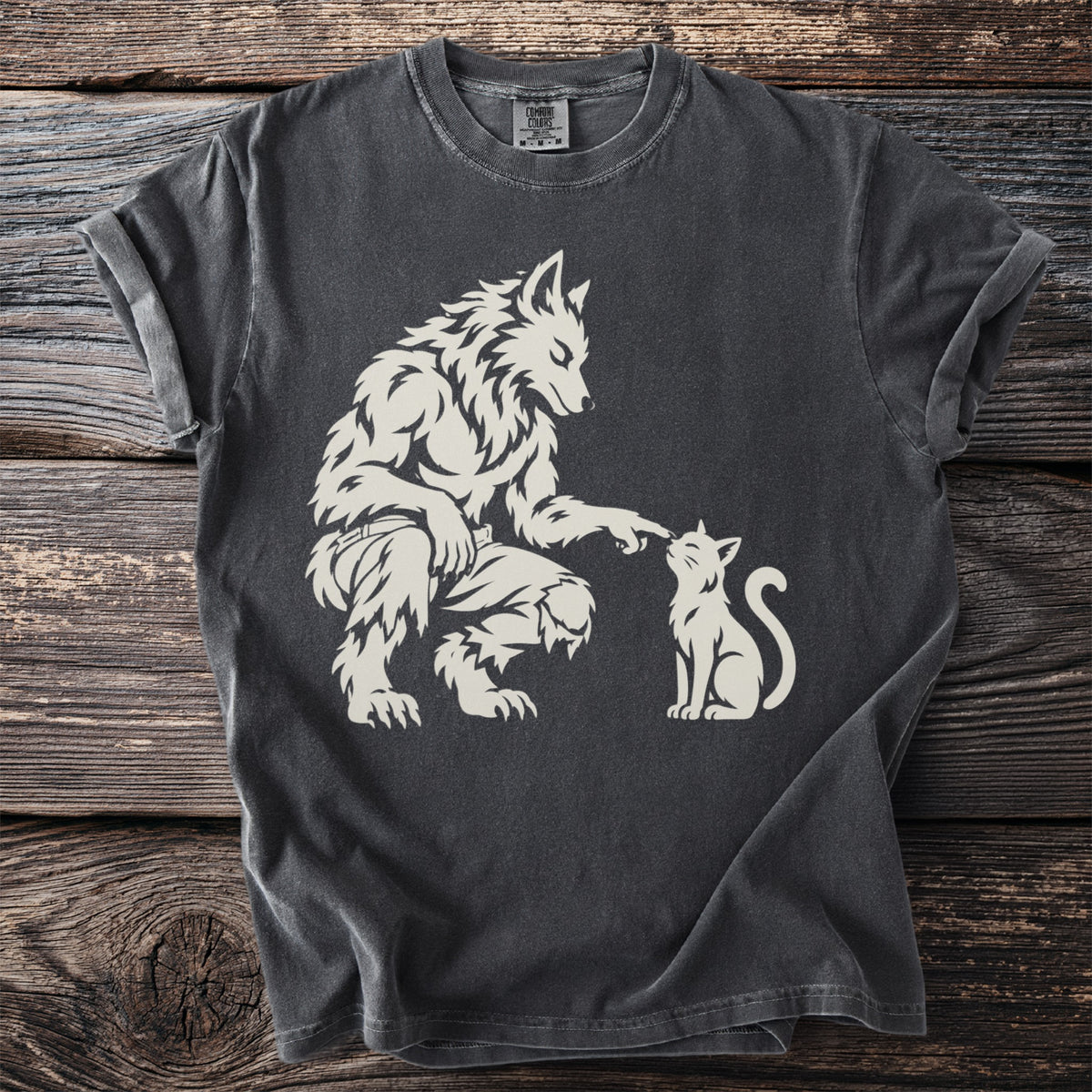 Werewolf gently touching a white cat on a charcoal grey t-shirt.