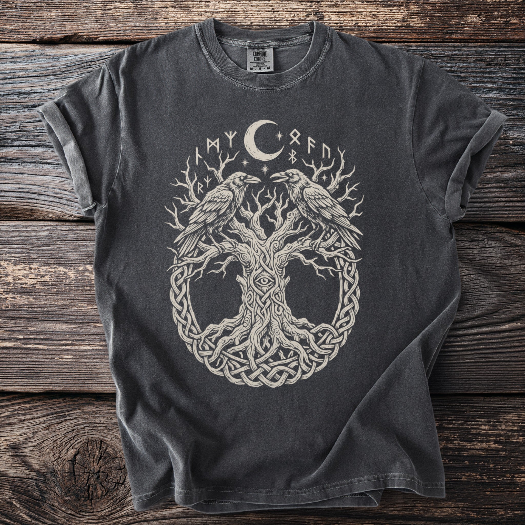 Dark t-shirt with a knotwork tree, two ravens, a moon, and runes.