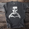T-shirt with split face of woman and skull making a heart shape with hands.