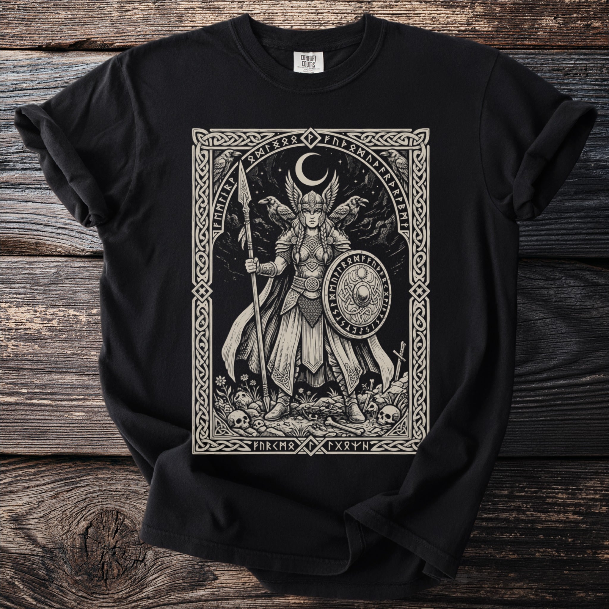 Viking warrior with shield and spear, surrounded by ravens and crescent moon.
