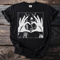 Black t-shirt with a graphic of a woman with horns making a heart shape with her hands.