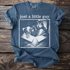 Blue t-shirt with "just a little guy" text and a werewolf in a box graphic.