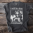 Dark t-shirt with wolf illustration and text "i will be okay eventually."