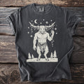 Pepper gray t-shirt with a cream folk-cut print: the Minotaur stands in the snow with a string of Christmas lights tangled around his horns.