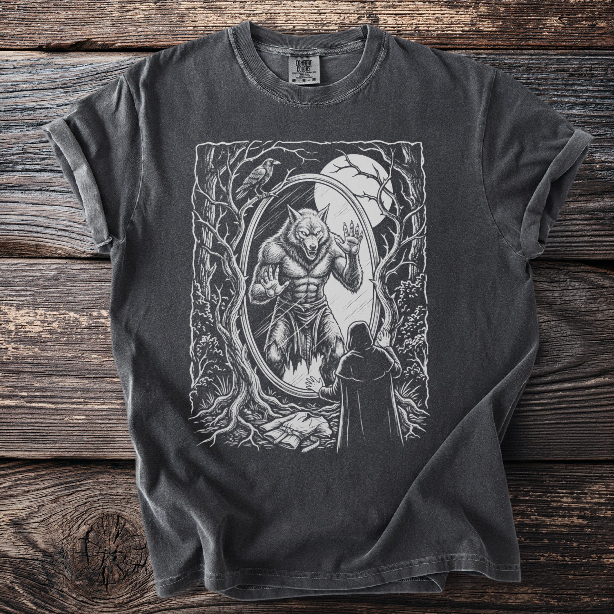 T-shirt with a dark wash and a werewolf transformation graphic in a forest scene.
