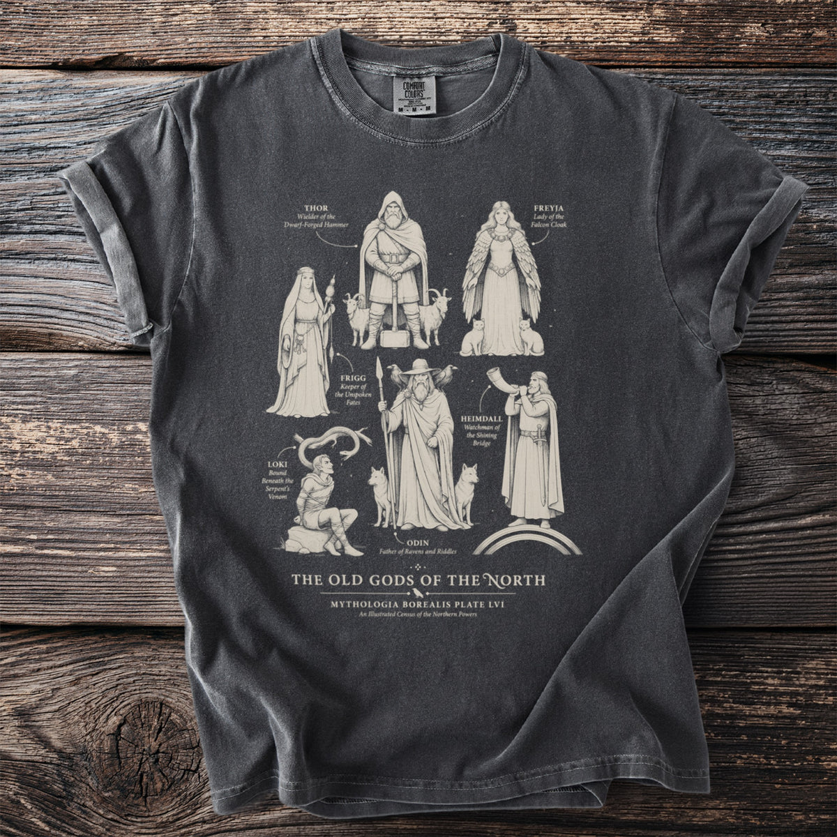 Dark grey t-shirt with illustrations of Norse gods: Thor, Freyja, Frigg, Heimdall, Loki, and Odin.