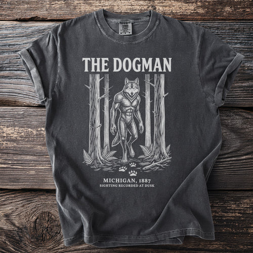 Dark gray t-shirt with "The Dogman" graphic of a werewolf in a forest.