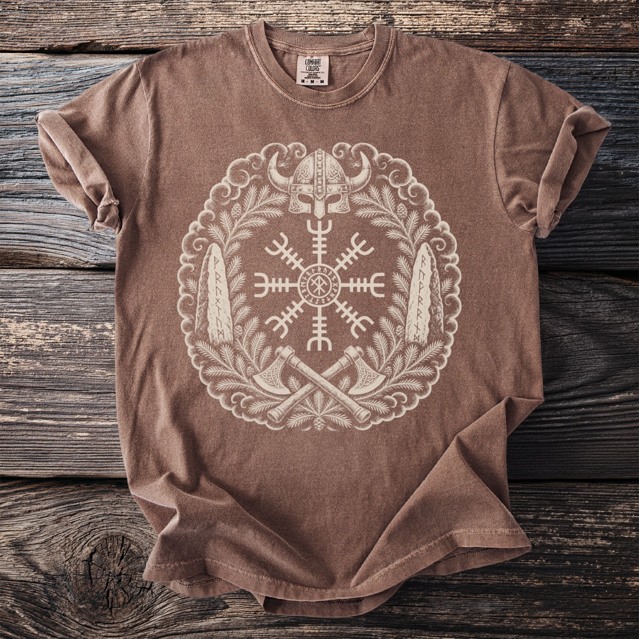 Brown t-shirt with a Viking helm, runes, axes, and wreath graphic.