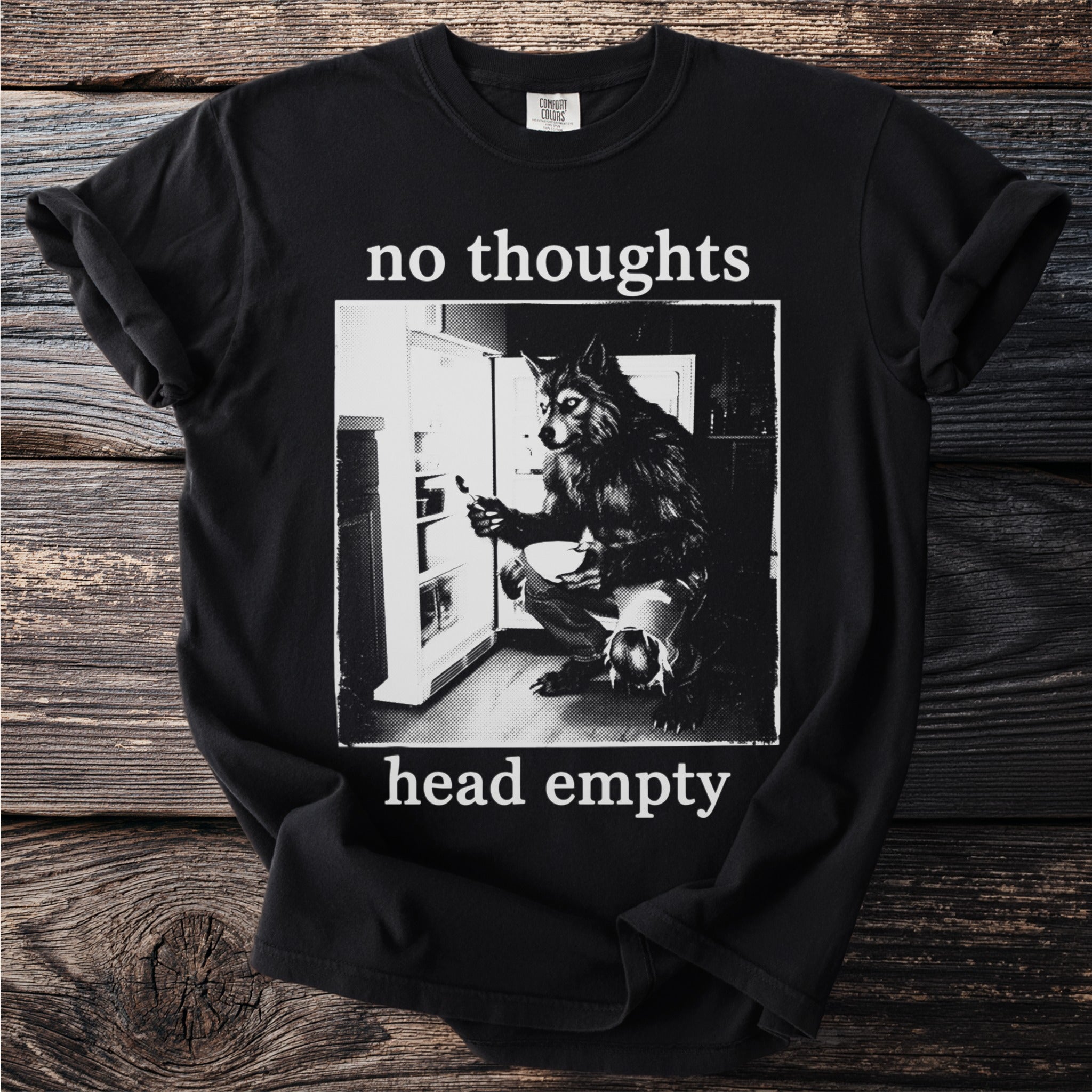 Black t-shirt with wolf at open refrigerator and text "no thoughts head empty."