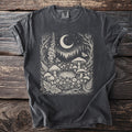 Dark gray t-shirt with a celestial woodland forest print featuring mushrooms, moon, and butterflies.