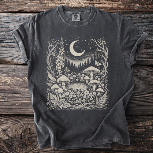 Dark gray t-shirt with a celestial woodland forest print featuring mushrooms, moon, and butterflies.