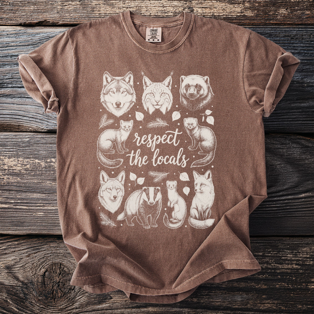 Brown t-shirt with "respect the locals" and illustrations of wild animals.