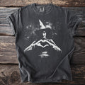Dark grey t-shirt with white graphic of a witch making a heart shape.