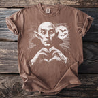 Brown t-shirt with a white graphic of a vampire making a heart shape with his hands.