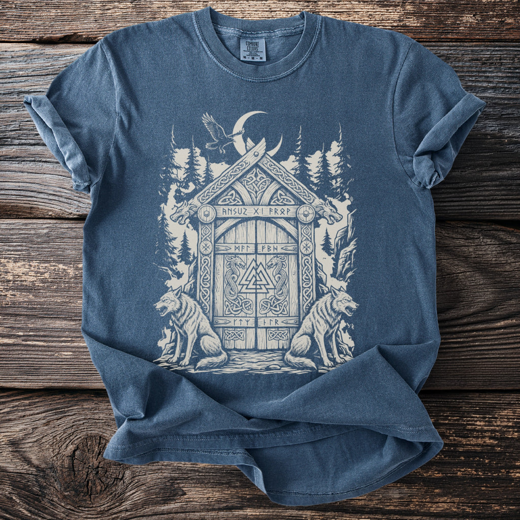 Blue t-shirt with a detailed faded print of a Viking-inspired gate with wolves and runes.