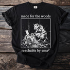 Black t-shirt with werewolf using a laptop on a tree stump, "made for the woods" and "reachable by email".