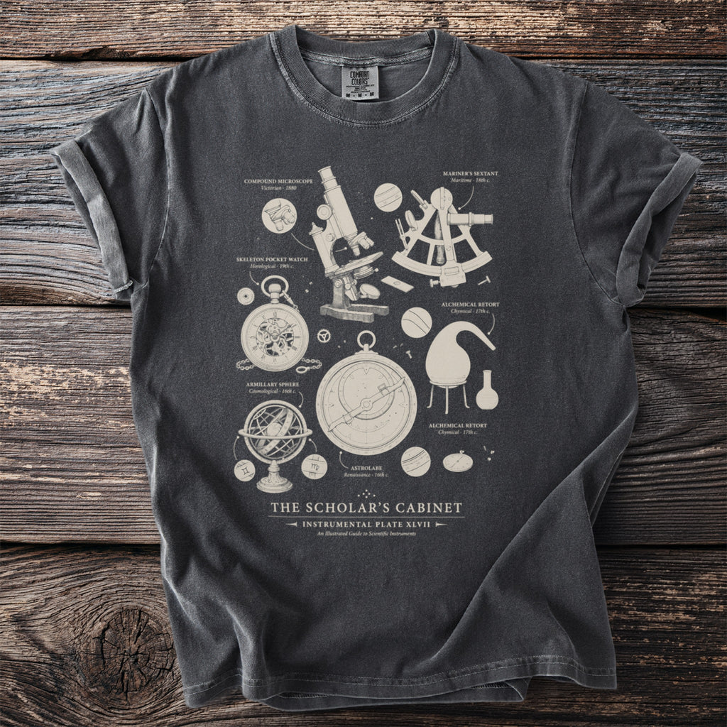T-shirt with scientific instruments illustration: microscope, sextant, astrolabe, and more.