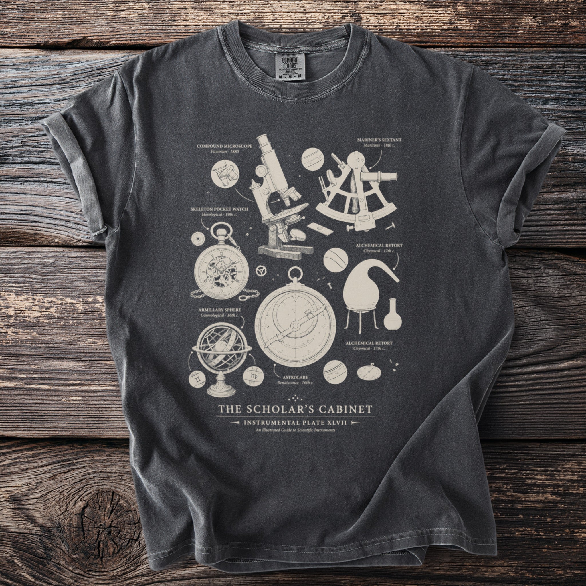 T-shirt with scientific instruments illustration: microscope, sextant, astrolabe, and more.