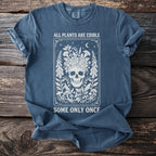 Blue t-shirt with white skull floral design and text: All Plants Are Edible Some Only Once