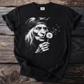 Black t-shirt with a vintage-style graphic of an elderly woman blowing a dandelion.