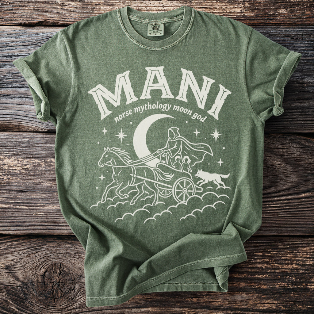 Green shirt with white graphic of Mani, norse moon god in a chariot pulled by horses.