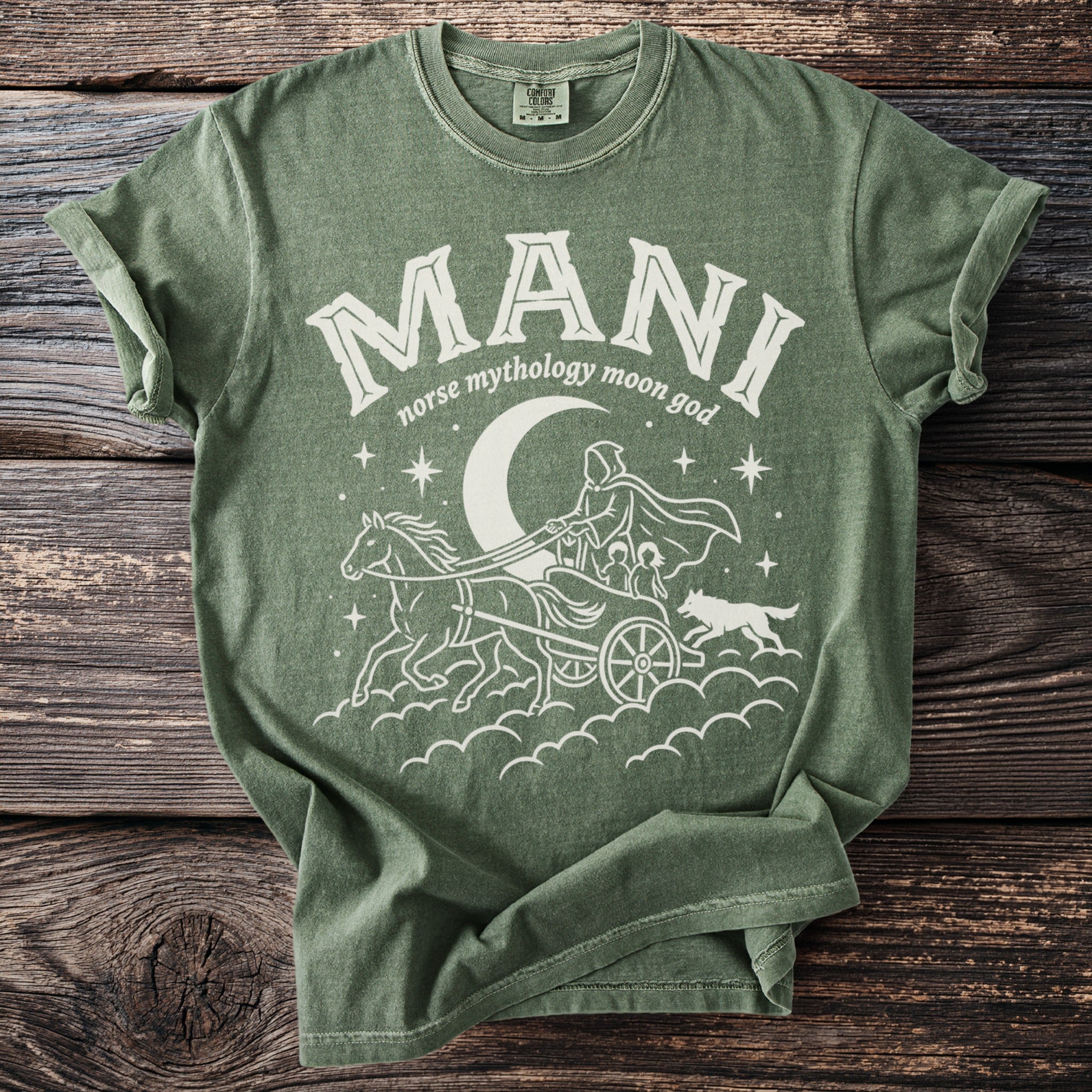 Green shirt with white graphic of Mani, norse moon god in a chariot pulled by horses.