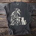 Plague doctor in mask and hat touching a white cat on a dark grey t-shirt.