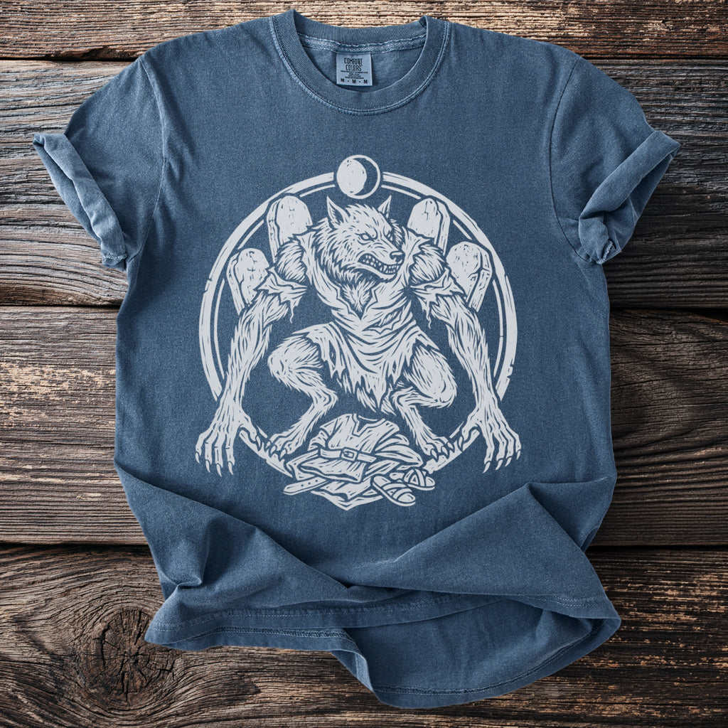 Blue t-shirt with white werewolf and moon graphic and Comfort Colors tag.
