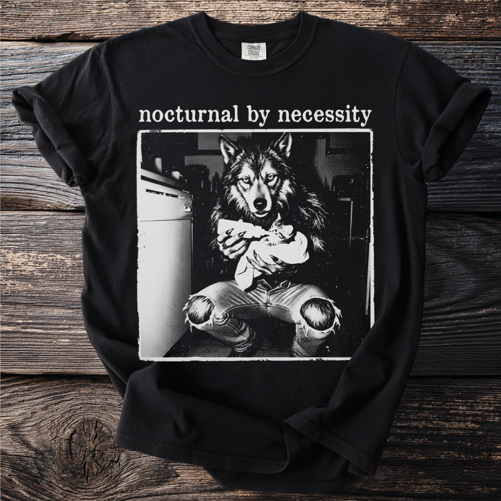 Black t-shirt with "nocturnal by necessity" and wolf holding kitten graphic.