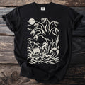 Black t-shirt with a cream print of six-headed Scylla reaching down toward a ship at sea.