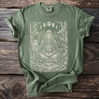 Green t-shirt with an ancient woman, wolf, raven, moon phases, and runes graphic.